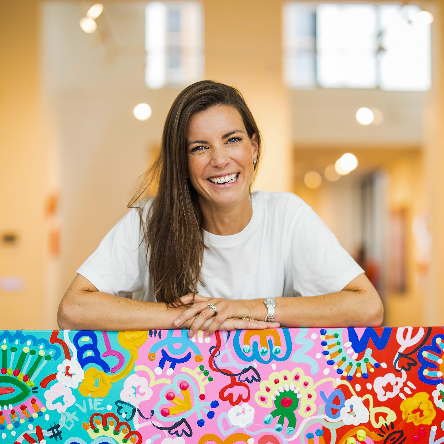Belgian contemporary artist Barbara Cox with Lancôme x Barbara Cox collaboration boxes
